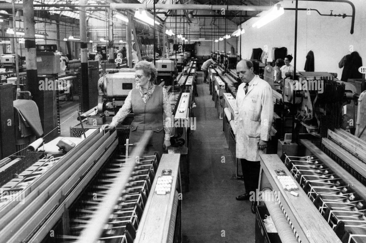 Black and white photo of workers in adhesive manufacturer.