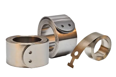 Set of three constant force springs. Two of the springs are in standard coiled form and one with extended strip and pick-up-straight.