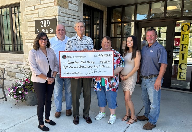 Fisher Barton Watertown Team Presenting a Donation Check to the Local Food Pantry