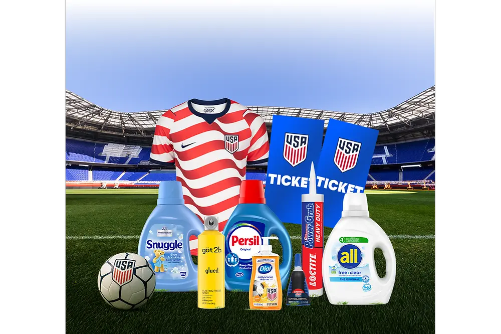 Henkel products on a soccer field with a jersey, soccer ball and tickets.