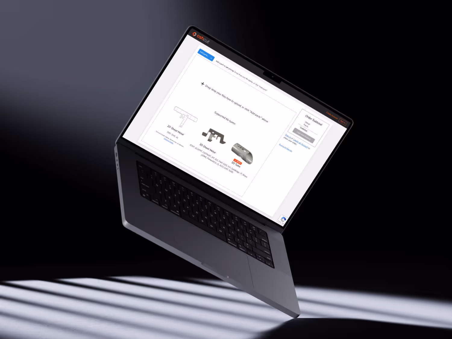 A macbook is open to app.oshcut.com's cart page where users can upload 2D and 3D design files